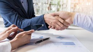 Publiplas|business handshake of two men demonstrating their agreement to sign agreement or contract between their firms companies enterprises scaled